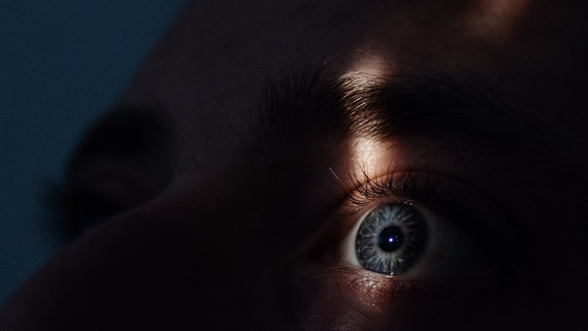 Close-up of a person's eye in soft light