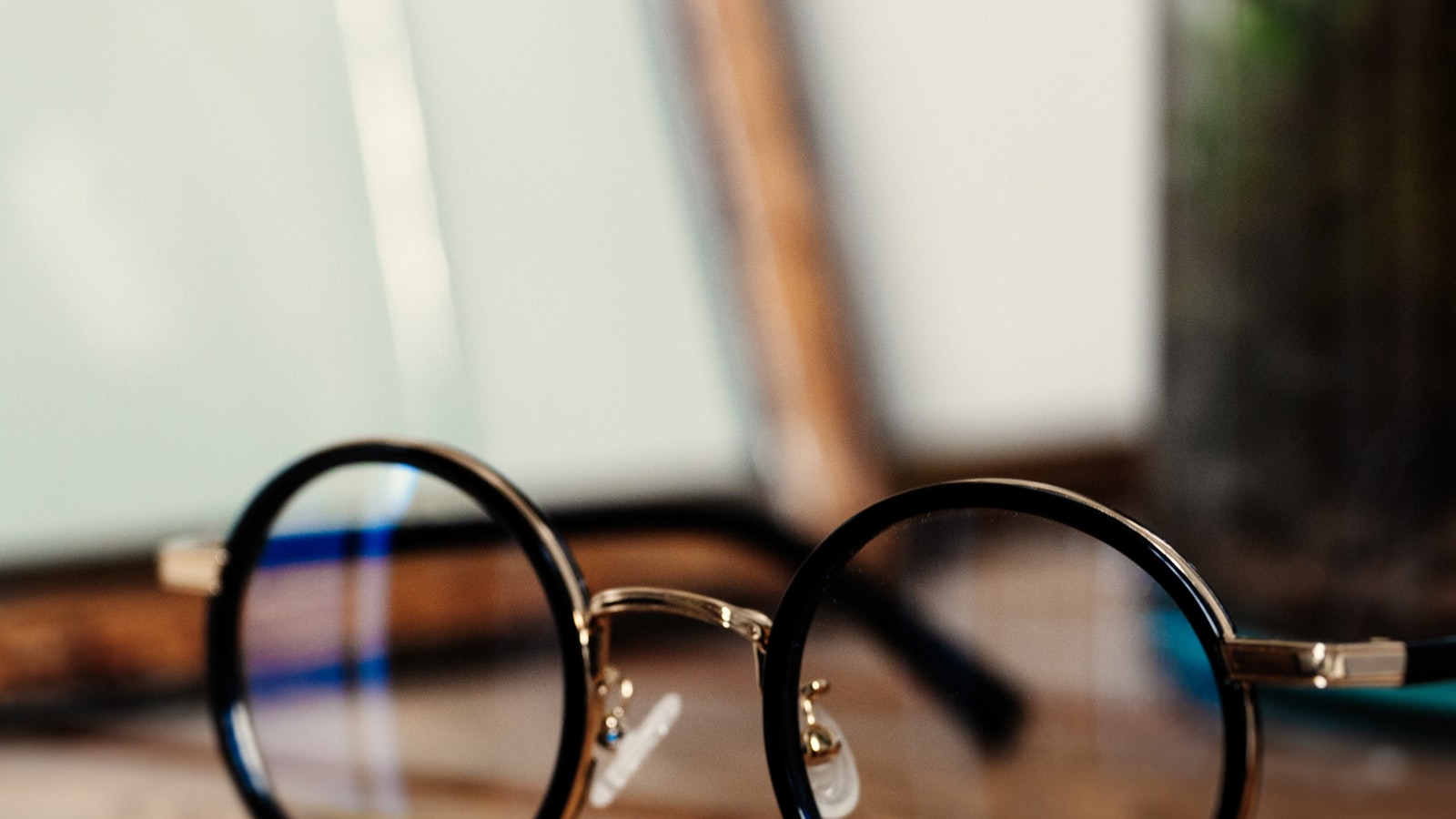 Close-up of round panto-shaped eyeglasses with a keyhole bridge