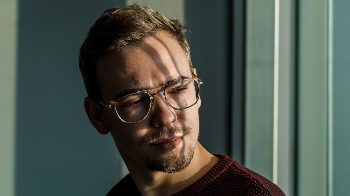 Person wearing glasses, front-facing portrait
