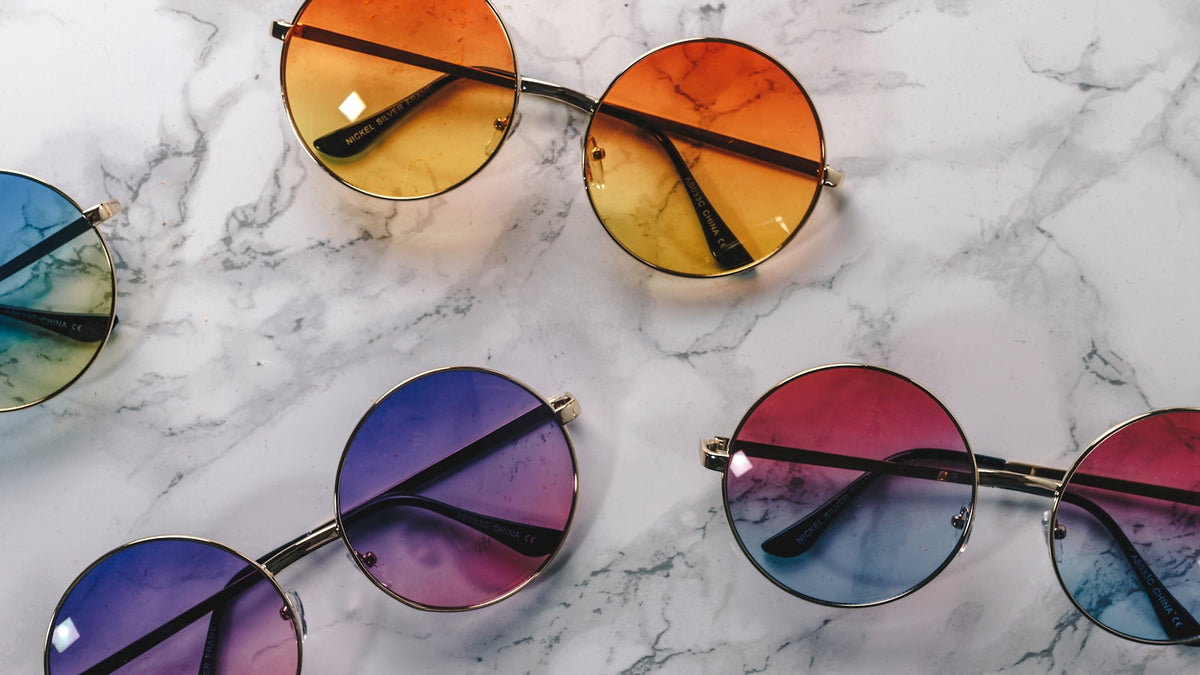 Black and brown framed sunglasses side by side