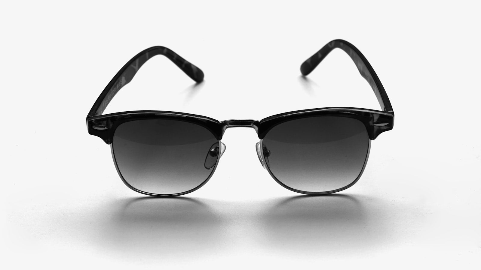 Very dark sunglasses lenses in harsh light — dark lenses without UV protection risk