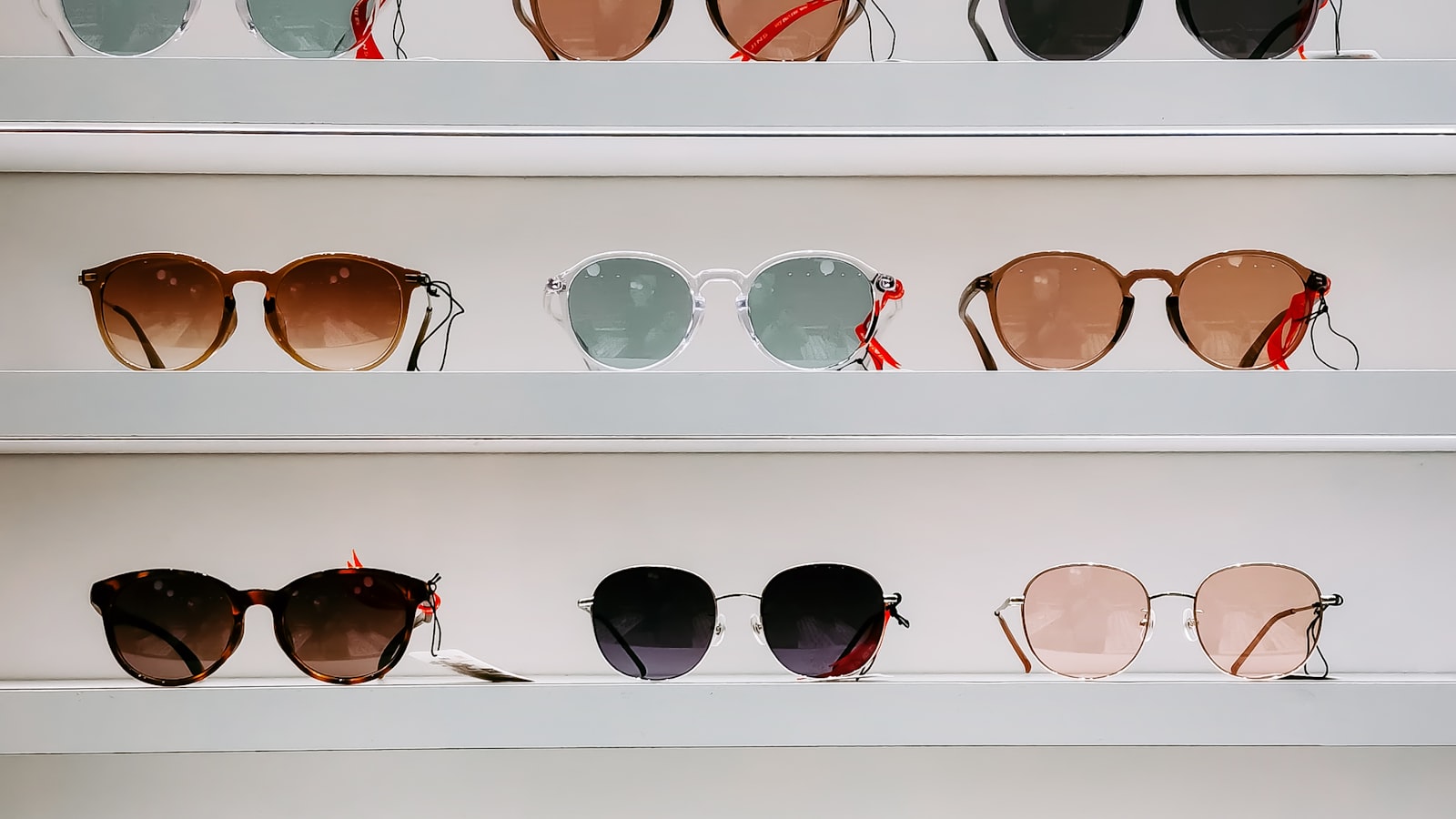 Sunglasses with different colored tinted lenses side by side — sunglasses lens color guide