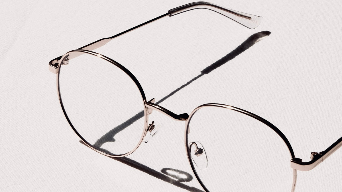 Close-up of eyeglass lenses reflecting light