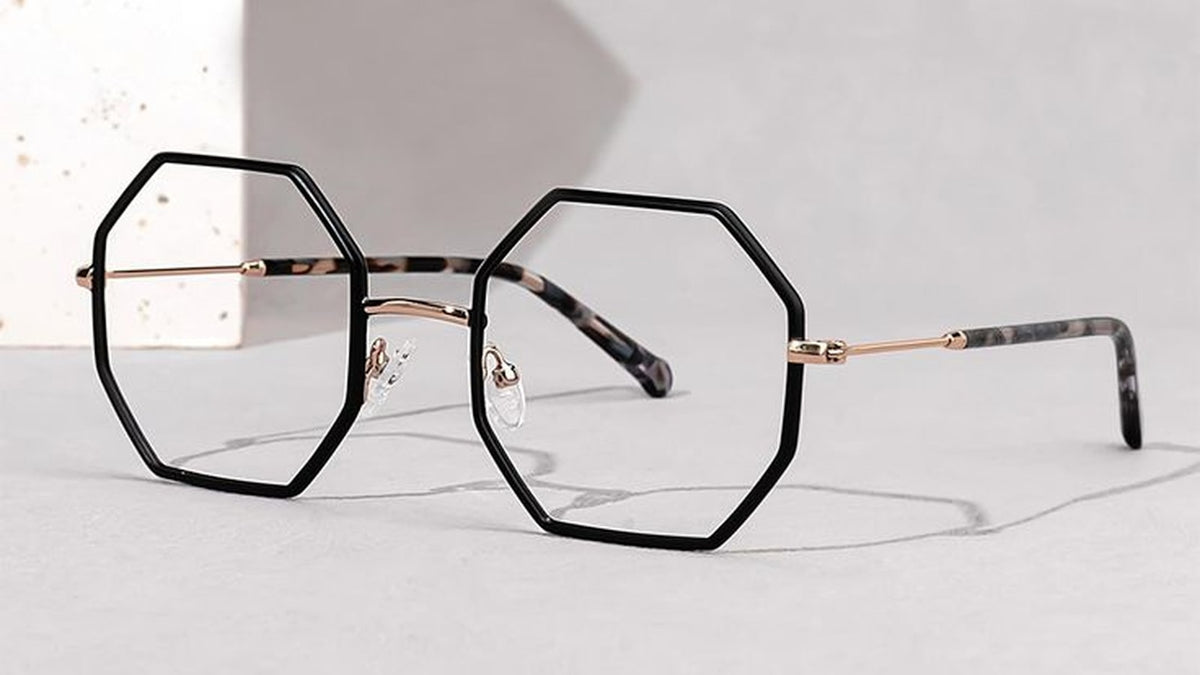Angular geometric eyeglasses resting on a surface