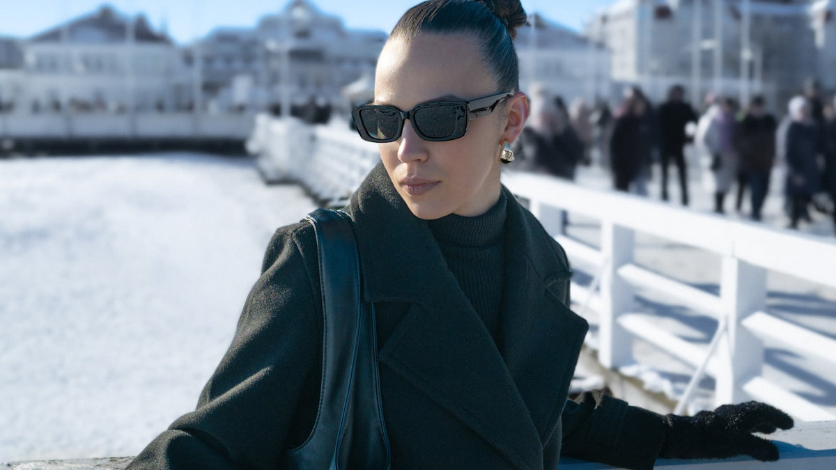 Woman wearing sunglasses on a sunny winter day