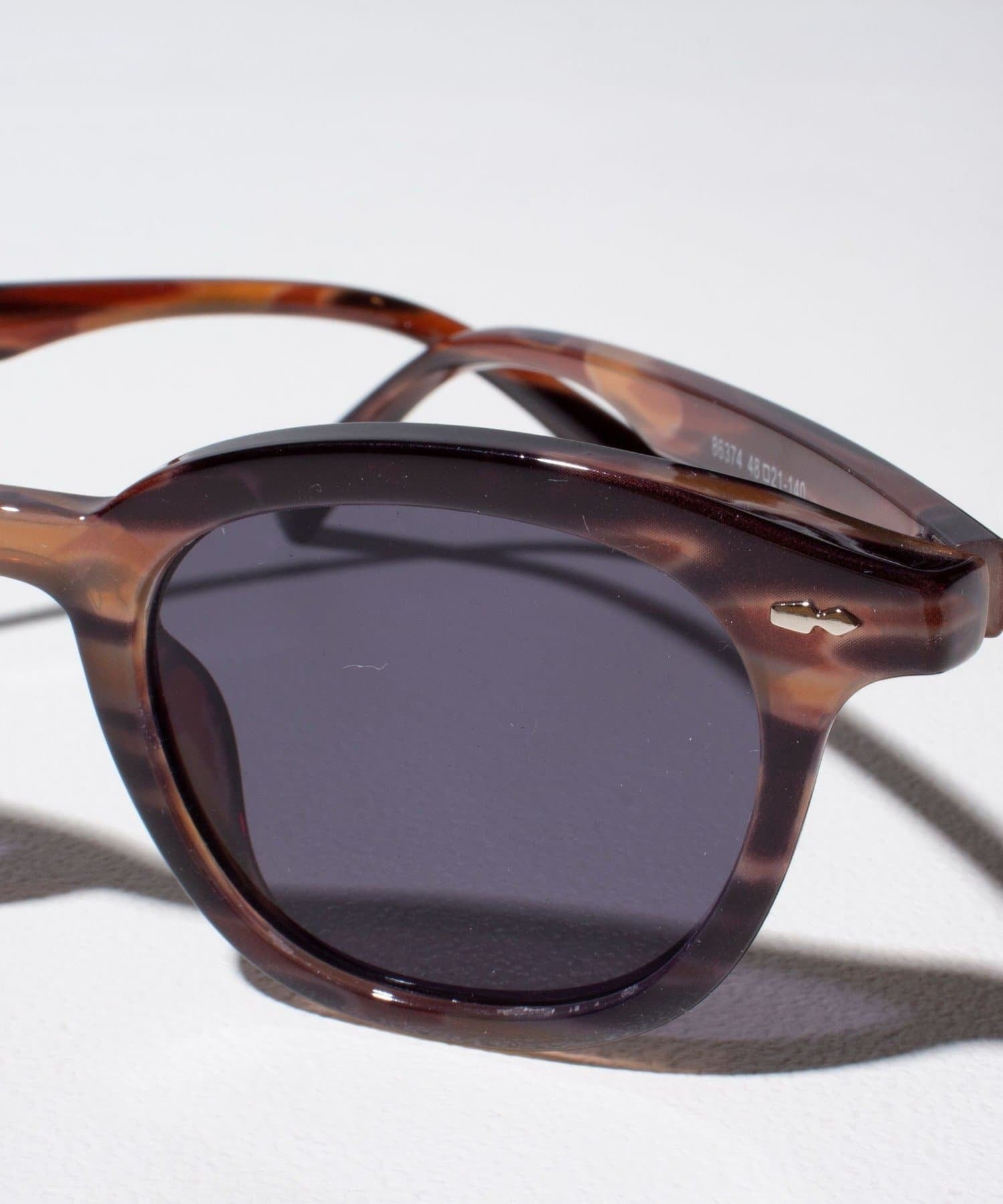 small rounded square tortoise sunglasses with black lenses lightweight
